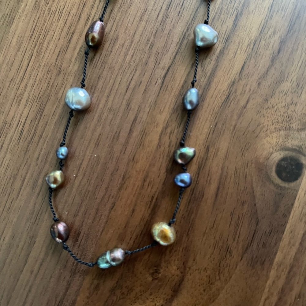 Beautiful colored freshwater pearls on black string, with jewelry pouch